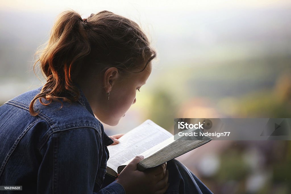 Reading the bible  Bible Stock Photo