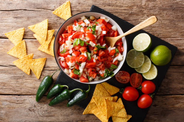 istock Mexican appetizer Pico de Gallo close-up in a bowl. Horizontal top view 1043146760