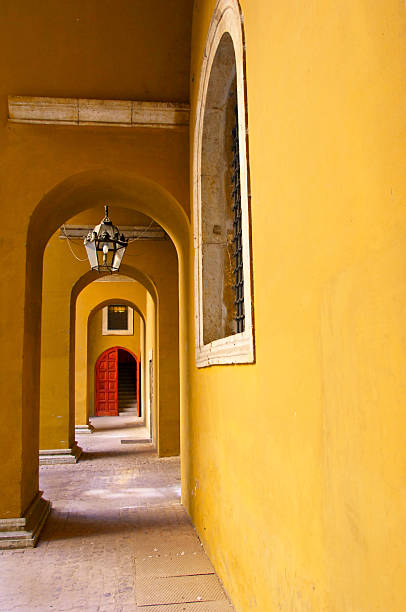 istock Arched Golden Passage Leading to Red Door 104315091