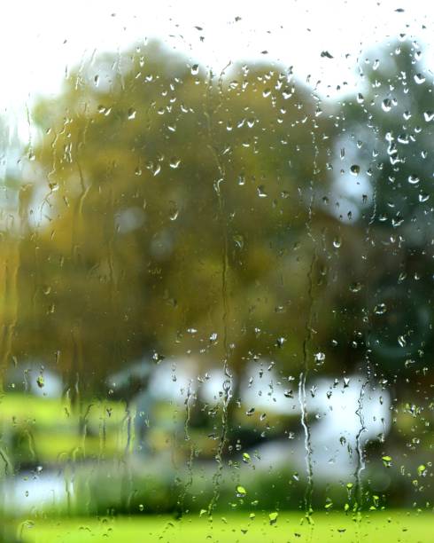 Heavy storm with rain on the window