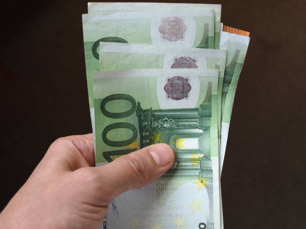 istock Hand with Euro notes, European Union 1043158604