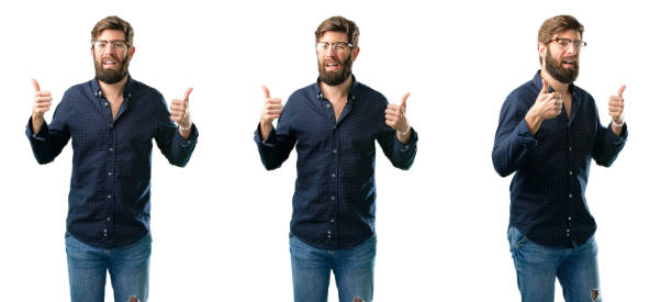 istock smiling broadly showing thumbs up gesture to camera, expression of like and approval 1043161710