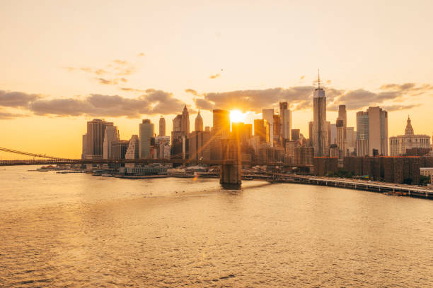View of New York Skyline and Brooklyn Bridge during sunset