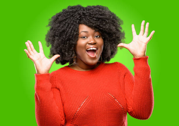 istock happy and surprised cheering expressing wow gesture 1043164882
