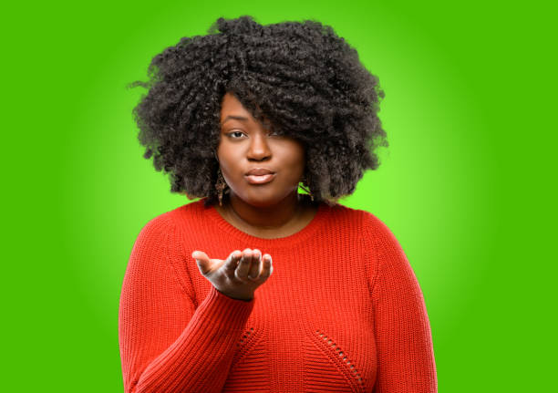 istock expressing love, blows kiss at camera, flirting 1043164956