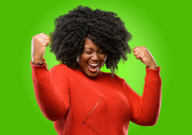 istock happy and excited expressing winning gesture. Successful and celebrating victory, triumphant 1043165320
