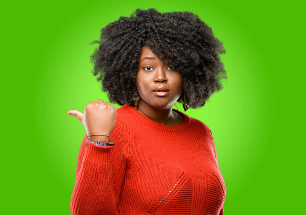 istock happy and surprised cheering expressing wow gesture pointing up 1043165500