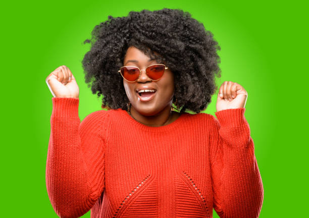 istock happy and excited expressing winning gesture. Successful and celebrating victory, triumphant 1043165514