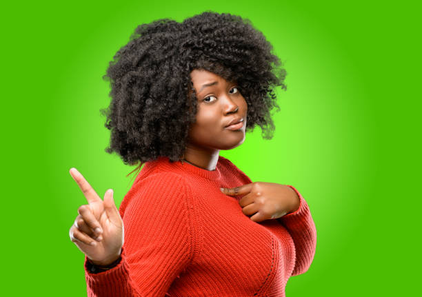 istock happy and surprised cheering expressing wow gesture pointing up 1043165650