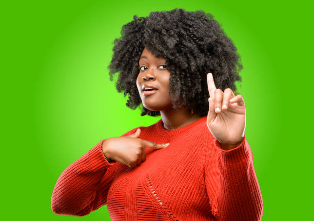 istock happy and surprised cheering expressing wow gesture pointing up 1043165690