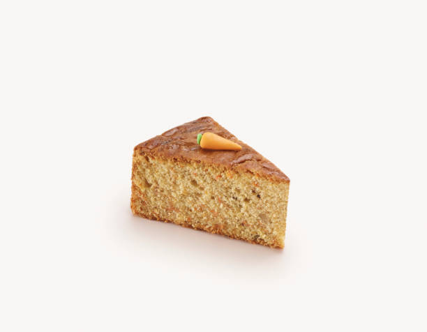 Delicious sliced carrot cake on white background