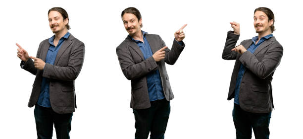 istock Handsome young man pointing away side with fingers 1043166604