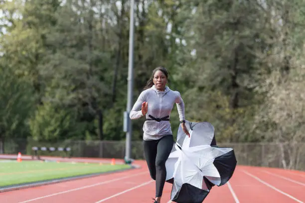 Photo of Female track athlete training at stadium