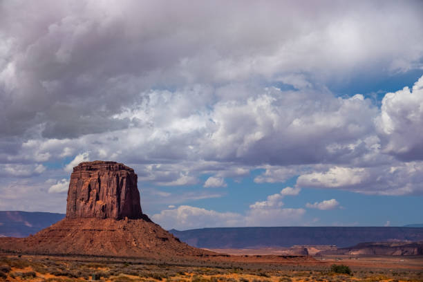 istock Butte in Monument Valley with dramatic clouds and blue sky 1043175428