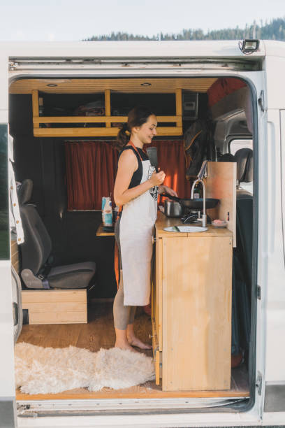 istock Woman cooking pancakes  in camper van 1043175508