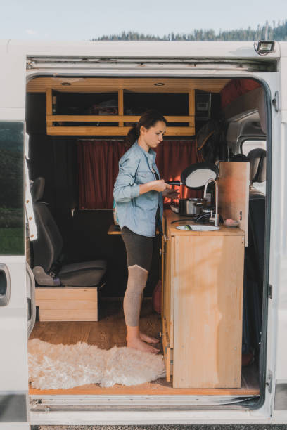 istock Woman cooking pancakes  in camper van 1043175516