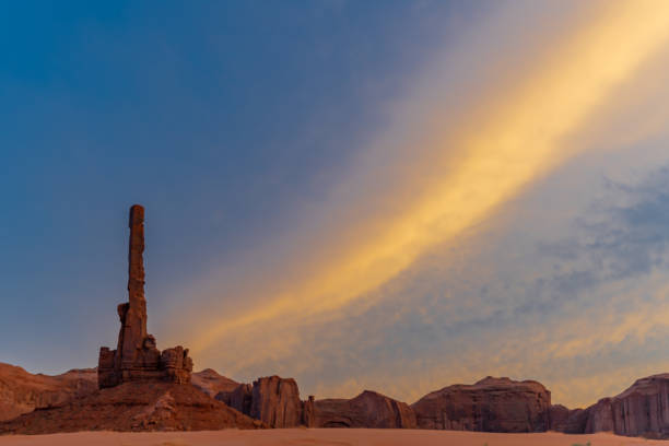 istock Totem pole in Monument Valley at sunset with dramatic light 1043175550