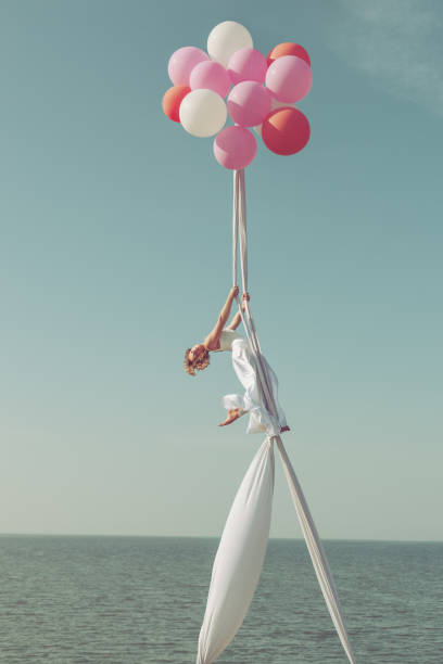 istock Gymnast on balls in the sky. 1043178628