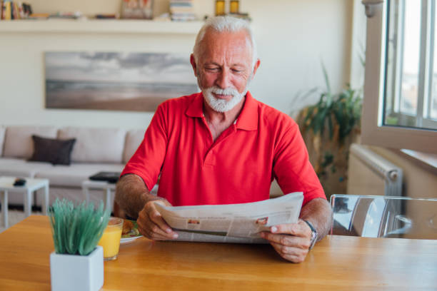 istock Grandfather reading newspapers 1043179720