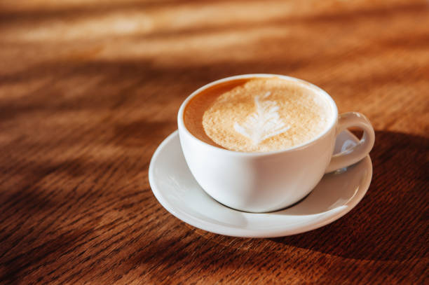 istock coffee cup latte art in cafe 1043184938