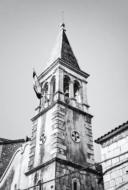 istock Church tower with Croatian flag, Trogir, colorless 1043185086