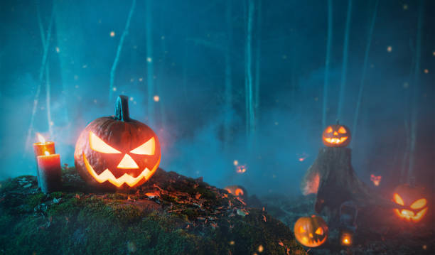 istock Spooky halloween pumpkins in forest 1043190530