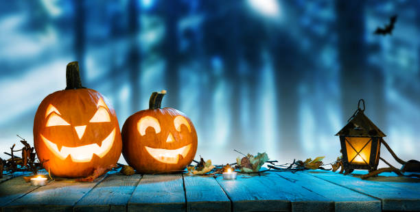 istock Spooky halloween pumpkins in forest 1043190568
