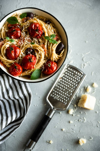 istock Italian pasta with tomato and basil. View from the top. 1043198714