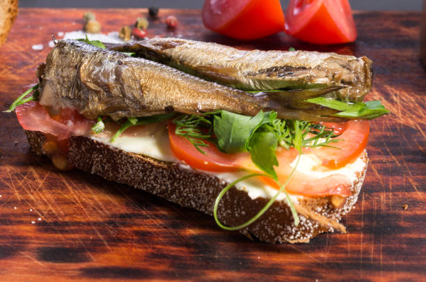 istock Smoked fish. Sandwich with fish and vegetables. 1043203024