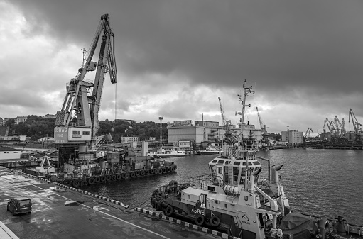 Odessa, Ukraine - Sep 10, 2018: Marine Industrial Commercial Port. Industrial zone of Odessa sea port. Container cranes. Cargo container terminal of sea freight industrial port.