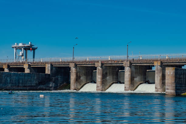 istock Dam water release into river. Water rushing through gates 1043213270