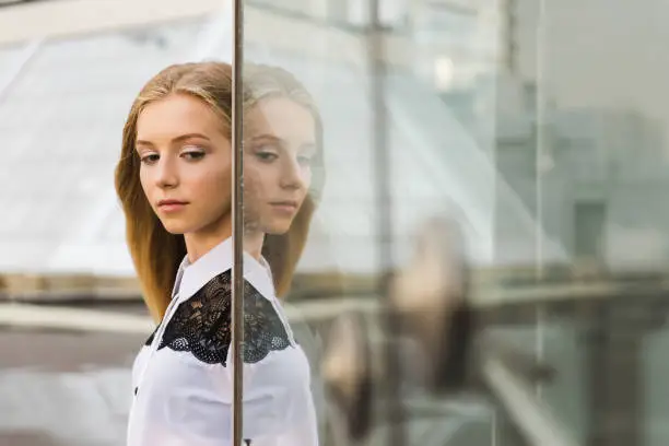 Photo of Portrait of girl with her glass reflection