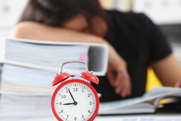 istock Tired and exhausted woman have a lot of work with documents fall asleep 1043218876