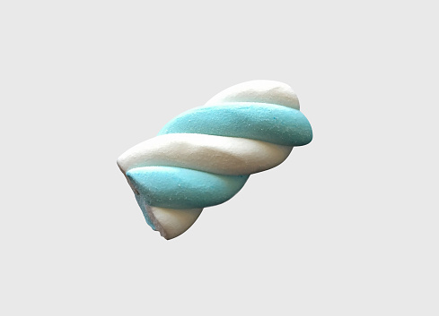 A marshmallow candy isolated on the light grey background