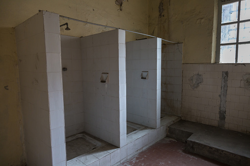 Ruined Showers in a Decadent Prison Room.