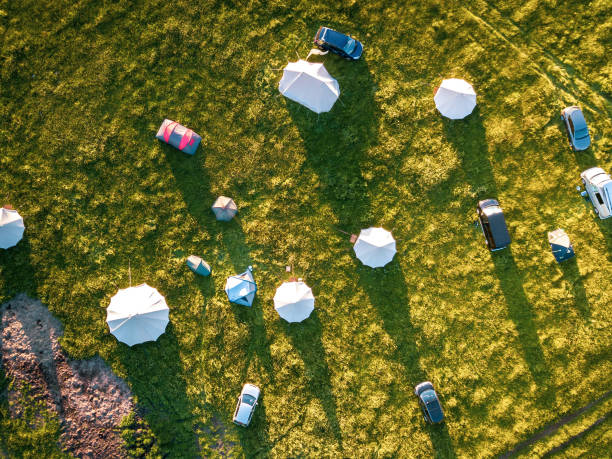 Aerial view of idyllic campsite at sunset with North London countryside as the backdrop. stock photo