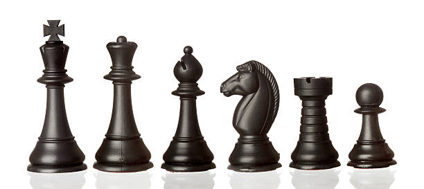 Black colored chess pieces lined up by height Chess pieces. Black team knight chess piece photos stock pictures, royalty-free photos & images