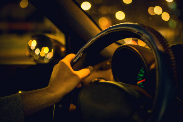 istock Driving a car at night, bokeh color 1043244160