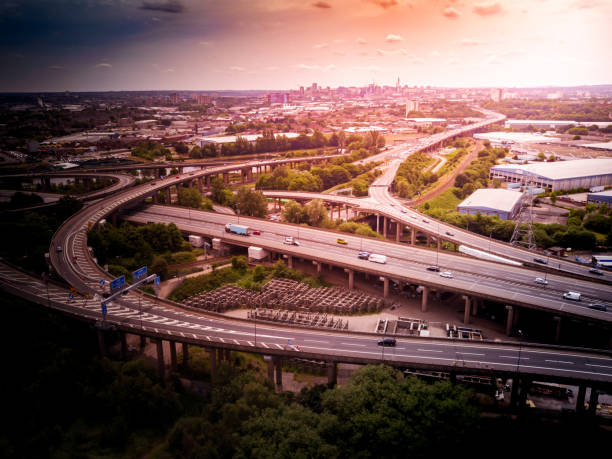istock Aerial view of a complex motorway road junction with traffic moving. 1043260436