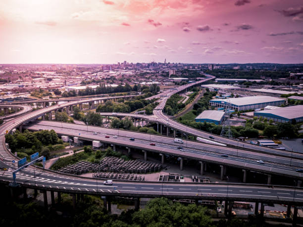 istock Aerial view of a complex motorway road junction with traffic moving. 1043262030