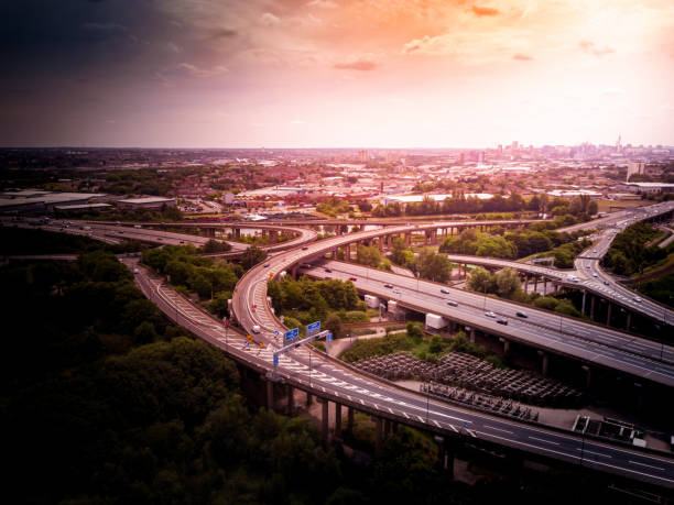 istock Aerial view of a complex motorway road junction with traffic moving. 1043262040