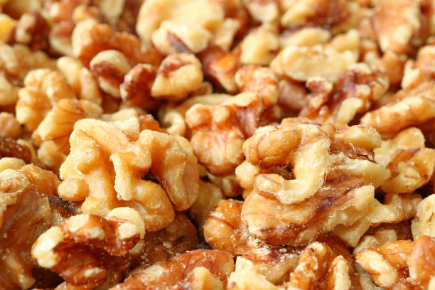 istock Closed Up Heap of Walnut Kernels for Nut Texture, Background, Banner 1043266300