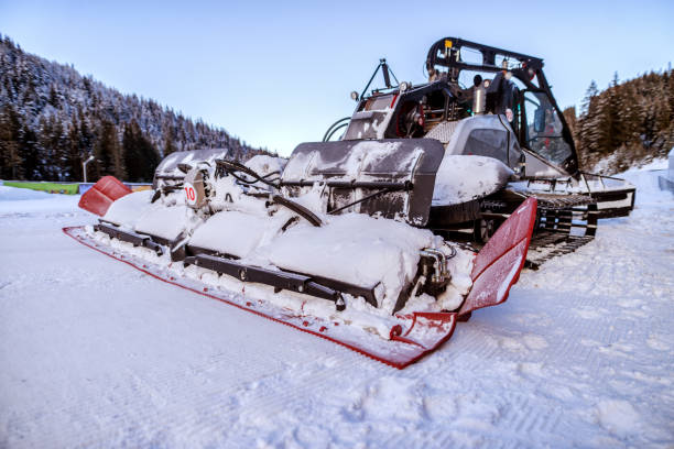 istock Bulldozer cleaning snow on mountain. Making road clean for car. 1043269936