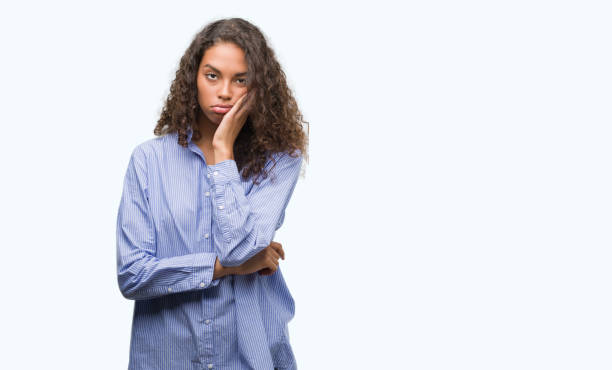istock Young hispanic business woman thinking looking tired and bored with depression problems with crossed arms. 1043275884
