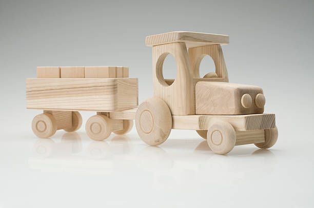 An antique toy tractor with pull string isolated on white