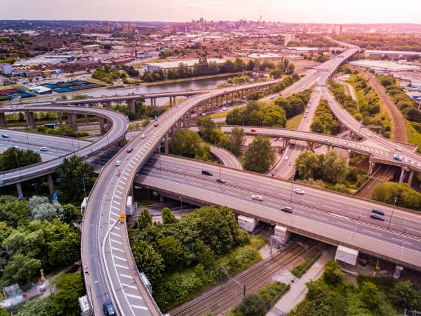 istock Aerial view of a complex motorway road junction with traffic moving. 1043282376