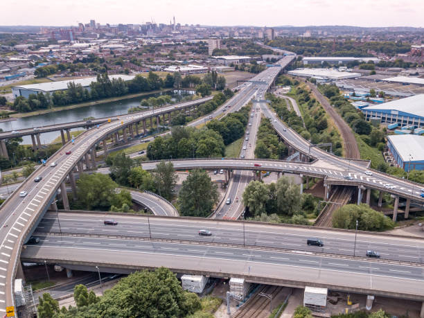 istock Aerial view of a complex motorway road junction with traffic moving. 1043282382