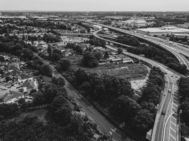 istock Motorway complex road junction aerial view with traffic moving in the UK 1043283020