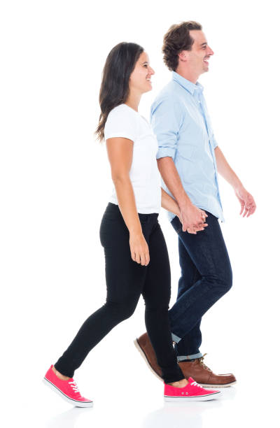 istock Happy couple walking and holding hands 1043287914