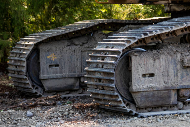 istock Industrial implement steel metal wheel tracks 1043292874